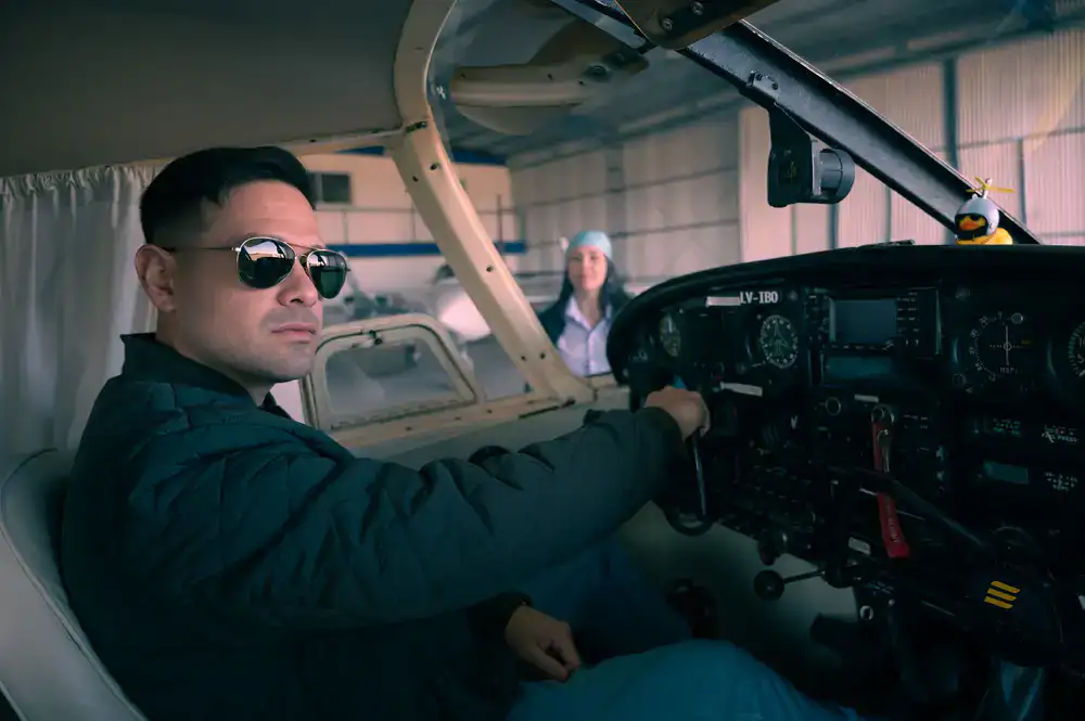 Instructor pointing at aircraft instruments during a briefing