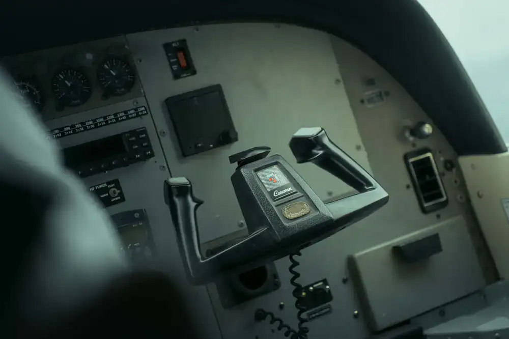 Close up of pilot hands on the control yoke