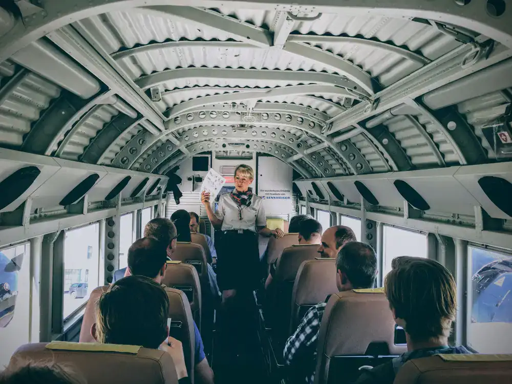 Instructor providing a pre-flight briefing to guests