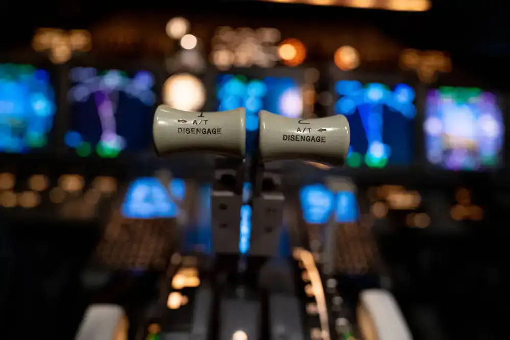 Close up of illuminated simulator cockpit instruments